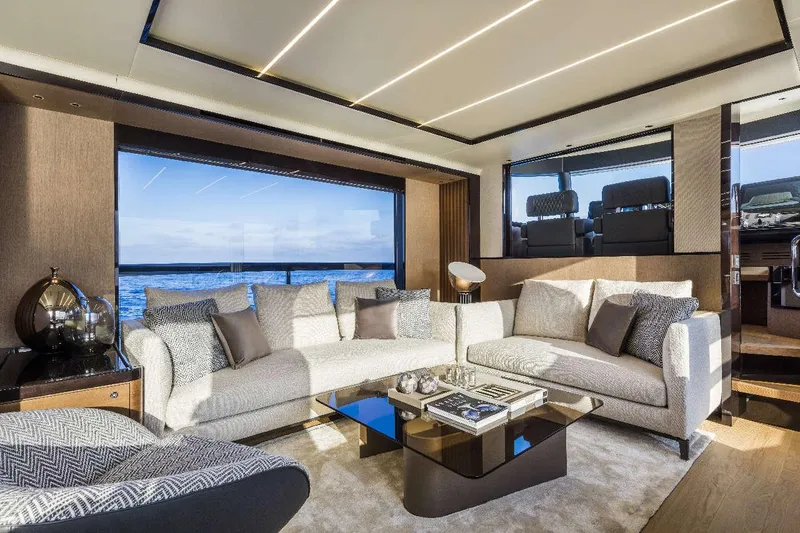  Yacht Photos Pics Luxurious interior of 2026 Absolute Navetta 68 yacht with elegant seating and ocean view.
