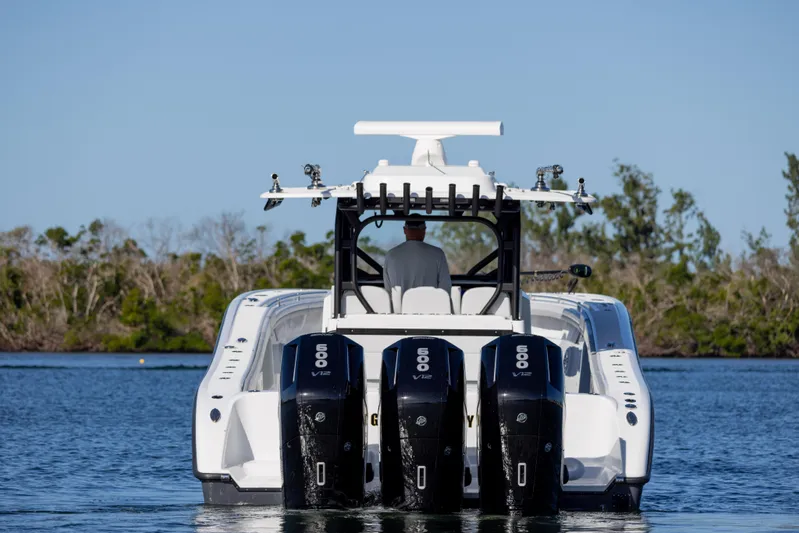  Yacht Photos Pics 2023 Yellowfin 42 boat with quad 600 horsepower engines on calm water.