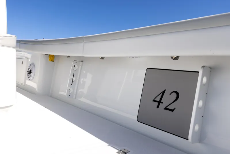  Yacht Photos Pics 2023 Yellowfin 42 boat interior with white finish and model number displayed.