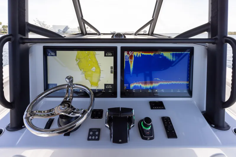  Yacht Photos Pics 2023 Yellowfin 42 boat dashboard with navigation and sonar screens.