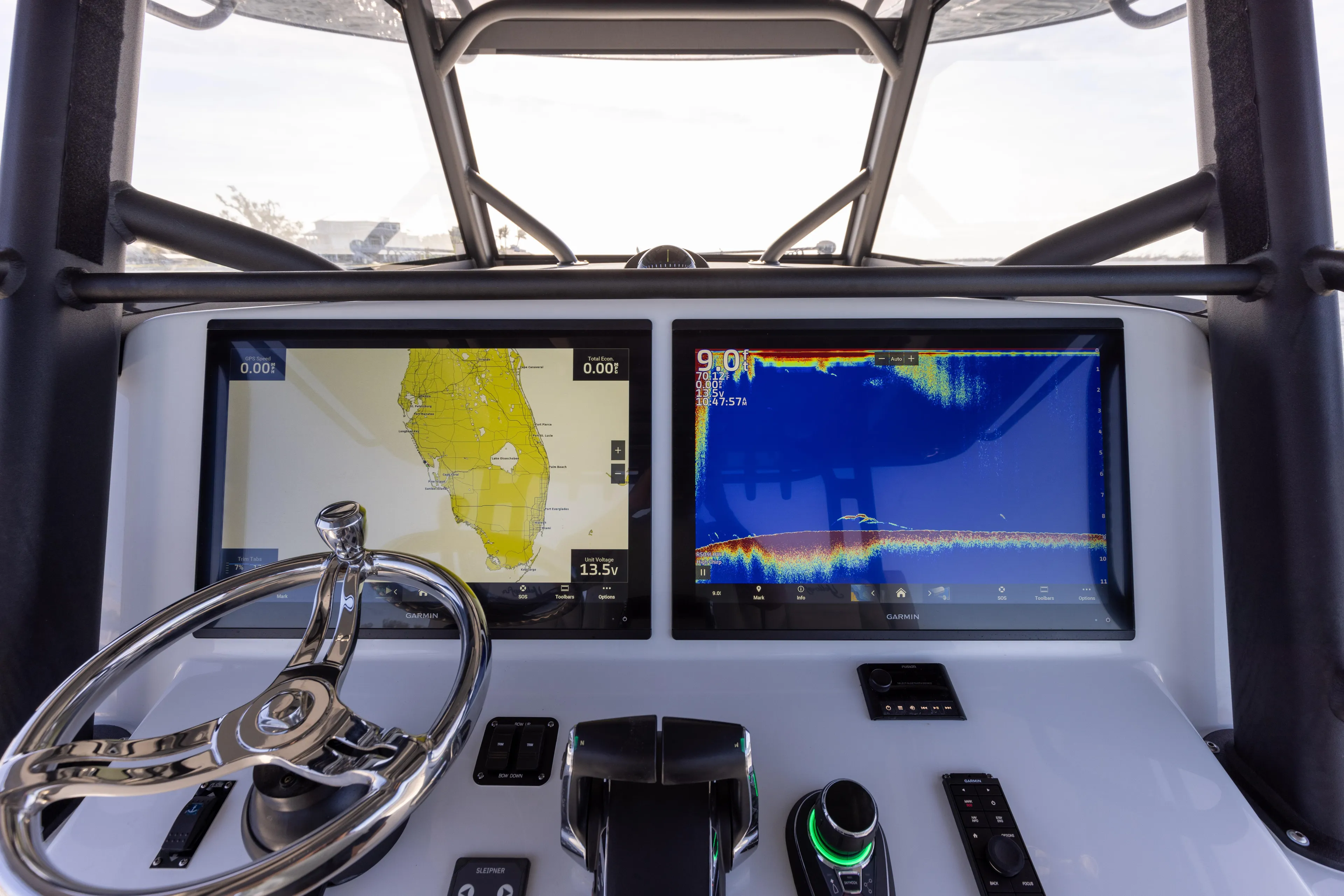  Yacht Photos Pics 2023 Yellowfin 42 boat dashboard with navigation and sonar screens.
