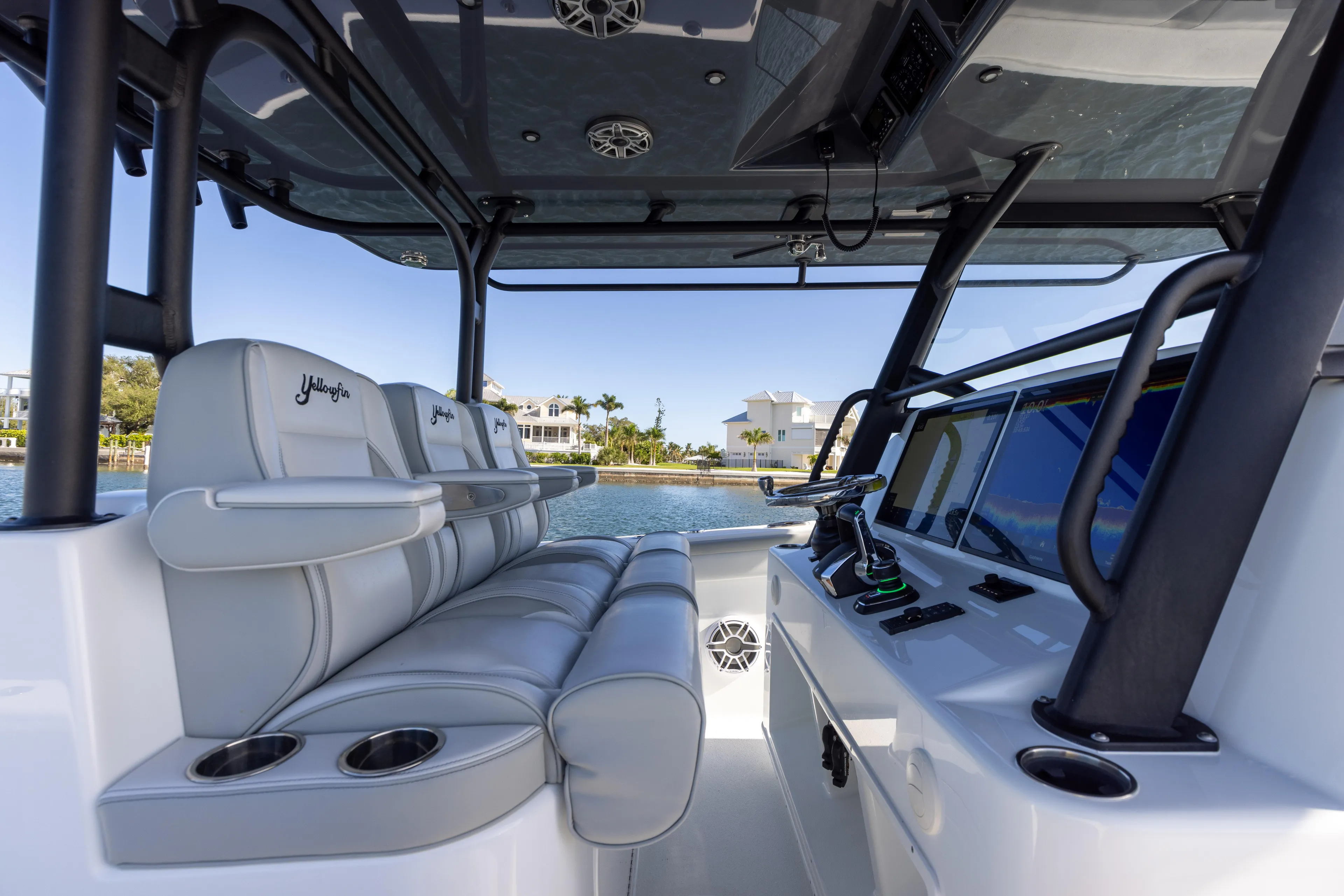  Yacht Photos Pics Interior of 2023 Yellowfin 42 boat with luxurious seating and modern controls.