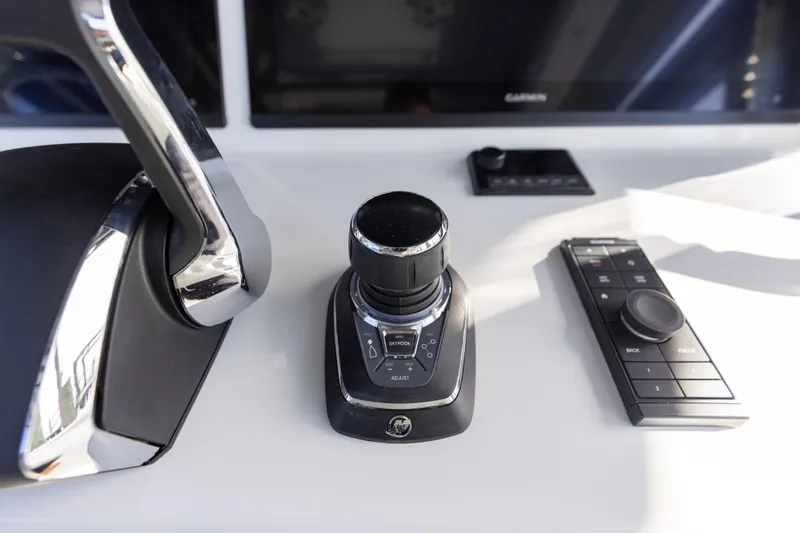  Yacht Photos Pics Control panel of a 2023 Yellowfin 42 boat with joystick and throttle.