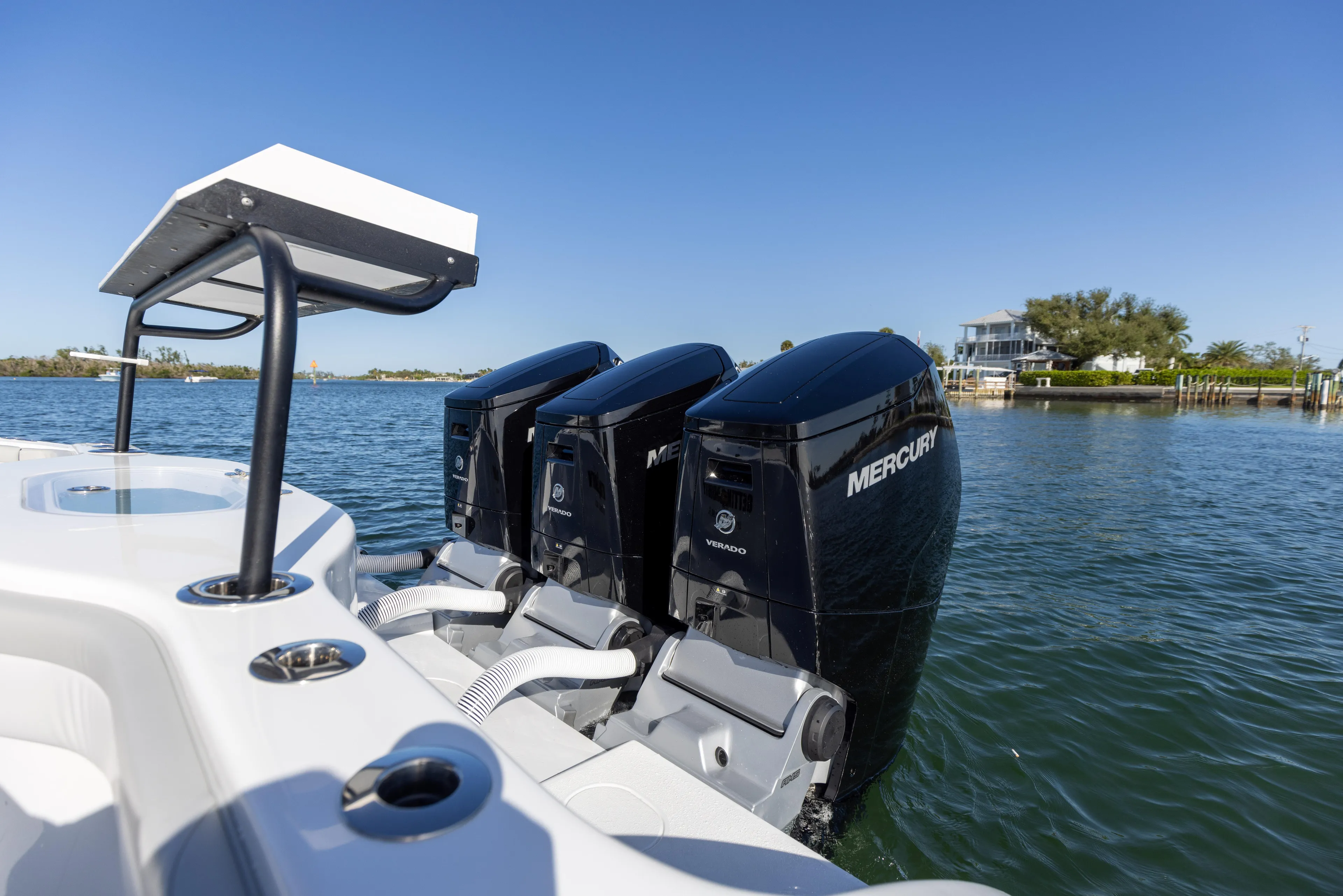  Yacht Photos Pics 2023 Yellowfin 42 boat with triple Mercury outboard engines on water.