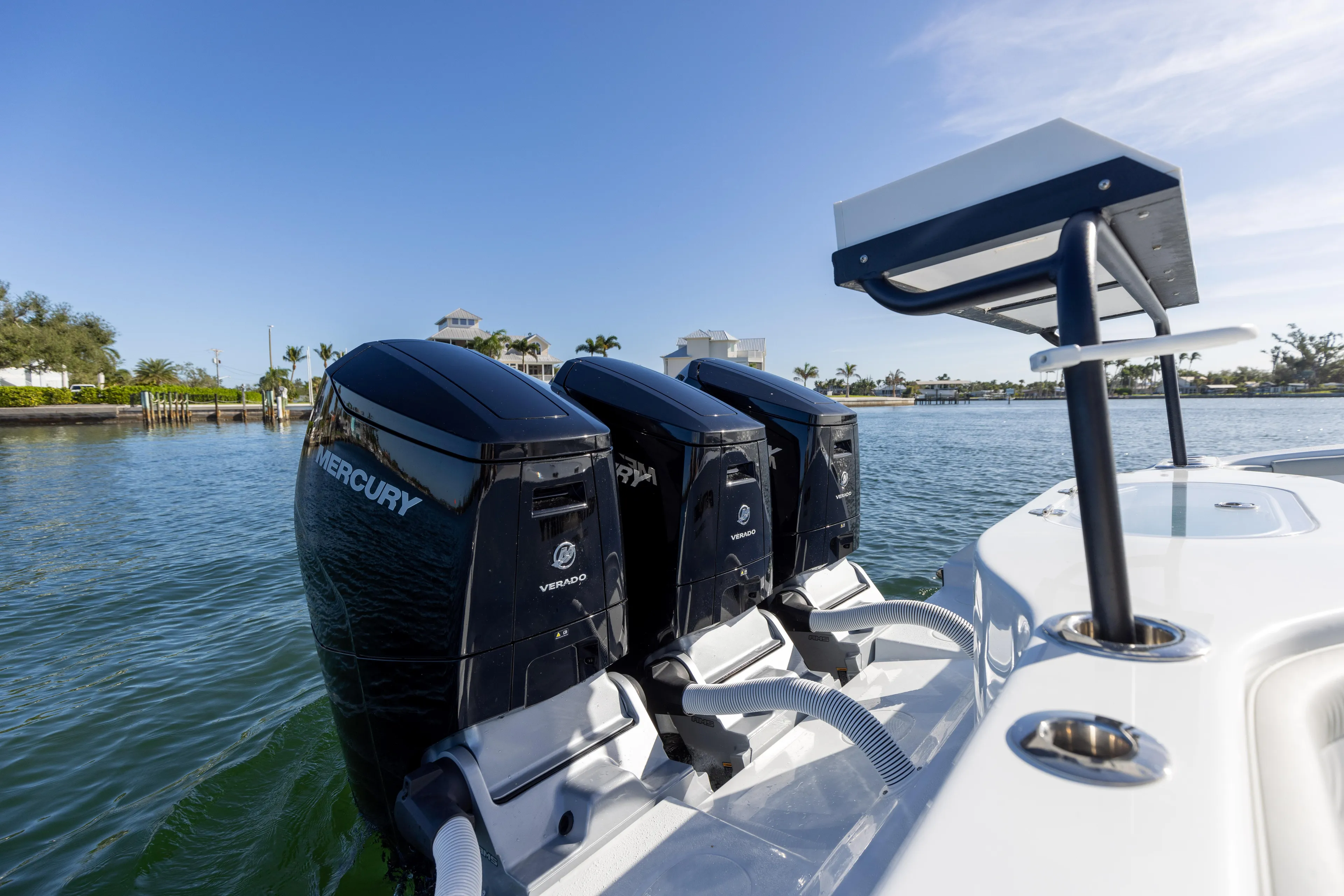  Yacht Photos Pics 2023 Yellowfin 42 boat with triple Mercury outboard engines on the water.