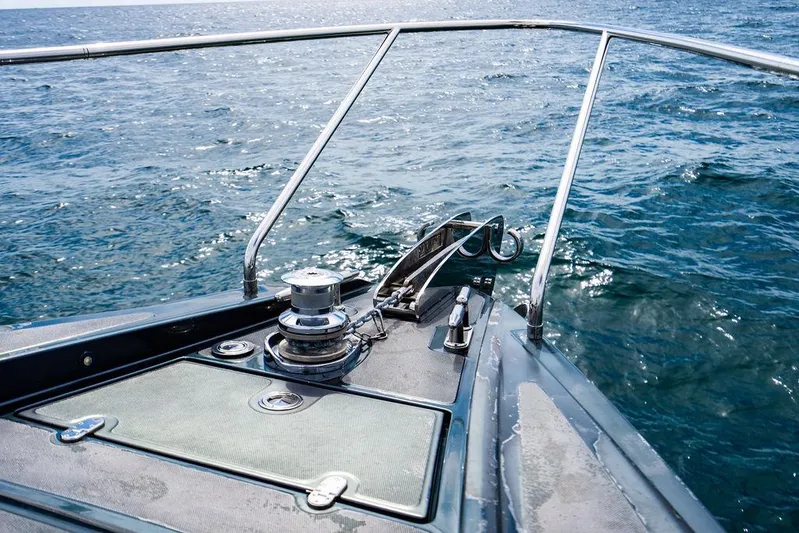 Two Bite Yacht Photos Pics Bow of 2018 Pershing 5x yacht on open sea, showcasing sleek design and ocean view.