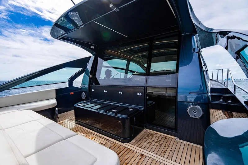 Two Bite Yacht Photos Pics Luxurious 2018 Pershing 5x yacht with sleek design and spacious deck, cruising on open water.