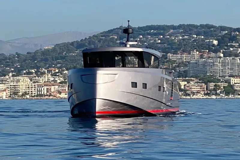  Yacht Photos Pics Modern Glacier 48 yacht cruising near coastal cityscape, 2026 model.