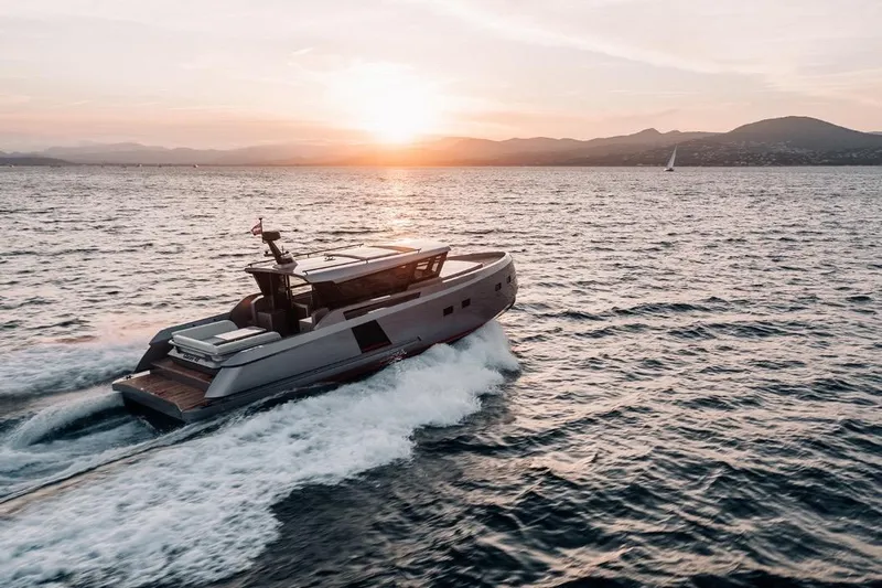  Yacht Photos Pics Luxury Glacier 48 yacht cruising at sunset, 2026 model, on open sea.