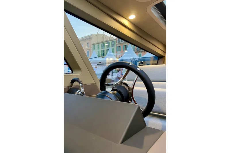  Yacht Photos Pics Interior view of 2026 Glacier 48, showcasing sleek steering wheel and modern design.