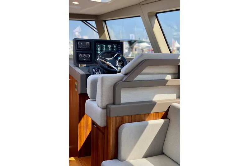  Yacht Photos Pics Modern Glacier 48 yacht helm with advanced navigation system, luxurious seating, and sleek design, 2026 model.