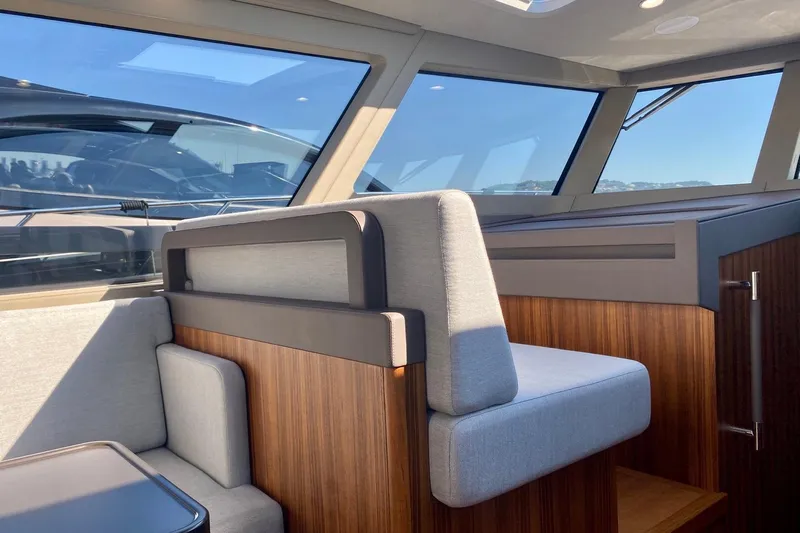  Yacht Photos Pics Interior of 2026 Glacier 48 yacht with modern seating and wooden accents.