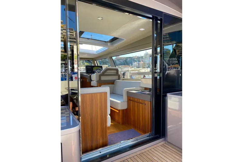  Yacht Photos Pics Luxurious interior of 2026 Glacier 48 yacht with modern seating and wood accents.