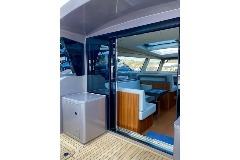  Yacht Photos Pics Modern Glacier 48 yacht interior, featuring sleek seating and panoramic windows, 2026 model.