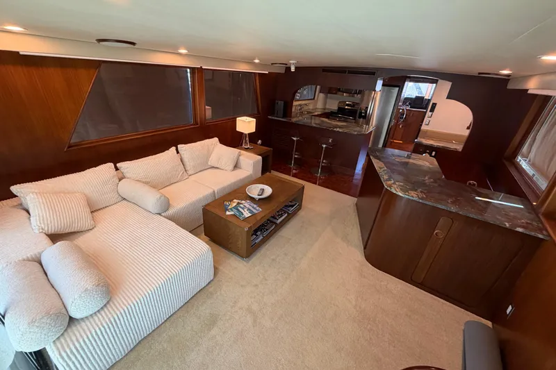  Yacht Photos Pics Luxurious interior of 1991 Hatteras 70 Motor Yacht with plush seating and modern kitchen.