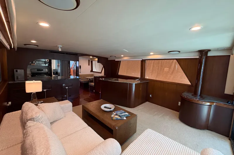  Yacht Photos Pics Luxurious interior of 1991 Hatteras 70 Motor Yacht with modern kitchen and cozy seating area.