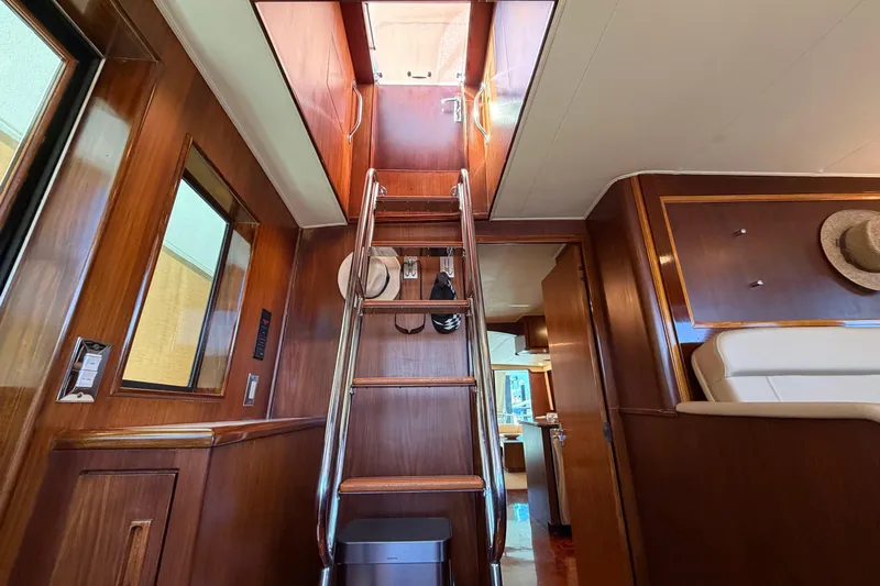  Yacht Photos Pics Interior of 1991 Hatteras 70 Motor Yacht with wooden stairs and elegant design.