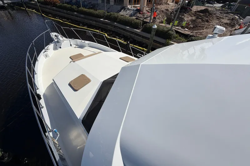  Yacht Photos Pics 1991 Hatteras 70 Motor Yacht deck view, showcasing sleek design and spacious layout.