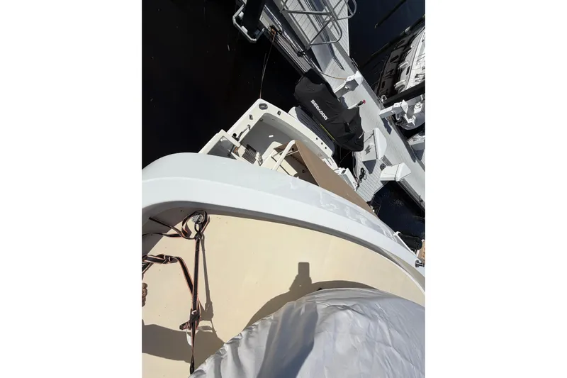  Yacht Photos Pics 1991 Hatteras 70 Motor Yacht docked, view from above, showing deck and nearby watercraft.