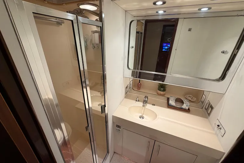  Yacht Photos Pics Bathroom interior of 1991 Hatteras 70 Motor Yacht with shower and vanity.