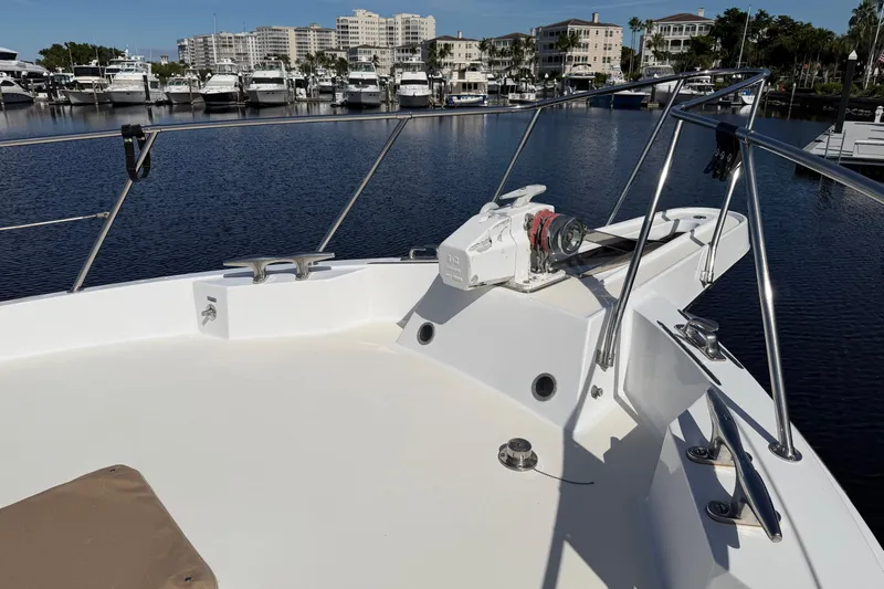  Yacht Photos Pics Bow view of 1991 Hatteras 70 Motor Yacht docked in marina.