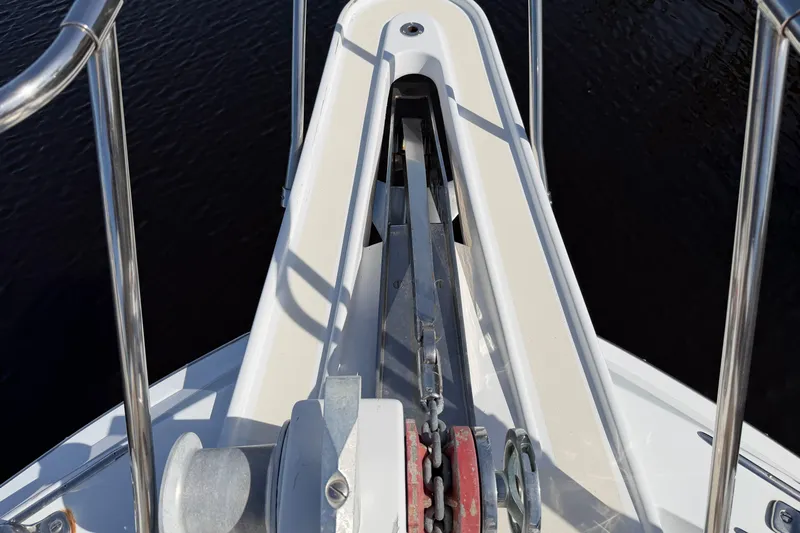  Yacht Photos Pics Bow view of 1991 Hatteras 70 Motor Yacht with anchor chain and railing.