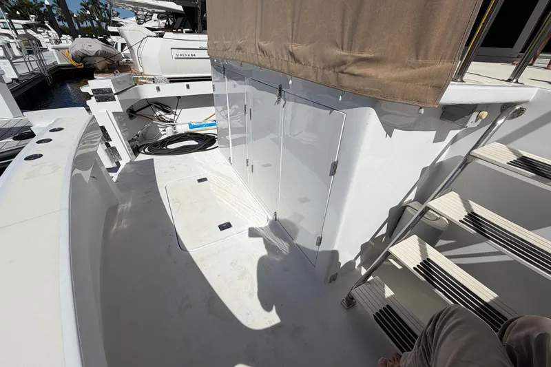  Yacht Photos Pics 1991 Hatteras 70 Motor Yacht deck with stairs and storage compartments.