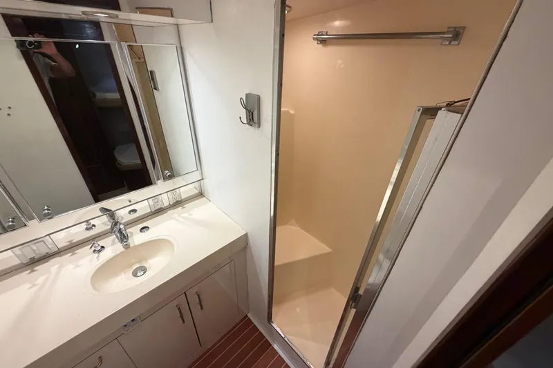  Yacht Photos Pics Bathroom interior of 1991 Hatteras 70 Motor Yacht with sink and shower.