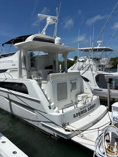  Yacht Photos Pics 2006 Carver 43 Motor Yacht docked at marina under clear blue sky.