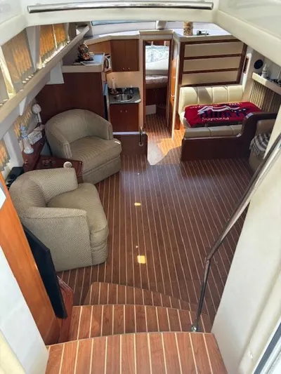  Yacht Photos Pics Interior of 2006 Carver 43 Motor Yacht with wood flooring and comfortable seating.