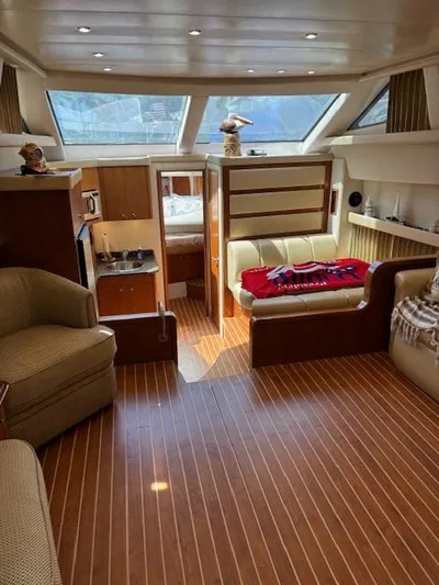  Yacht Photos Pics Interior of 2006 Carver 43 Motor Yacht with wood flooring and cozy seating area.