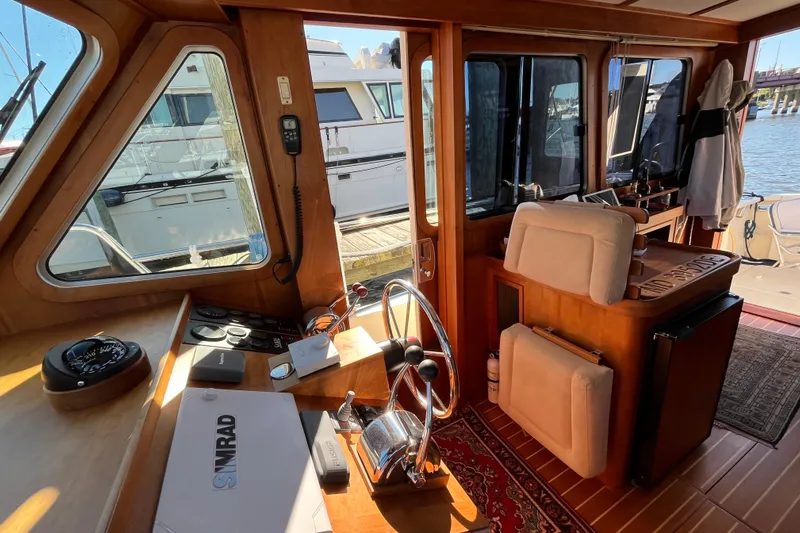 Sachem Yacht Photos Pics Interior view of 2006 Sabre 36 Flybridge Sedan, featuring helm and navigation equipment.