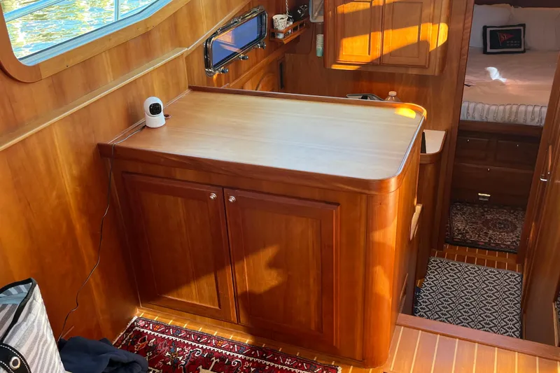 Sachem Yacht Photos Pics Interior of 2006 Sabre 36 Flybridge Sedan with wooden cabinetry and cozy bedroom.