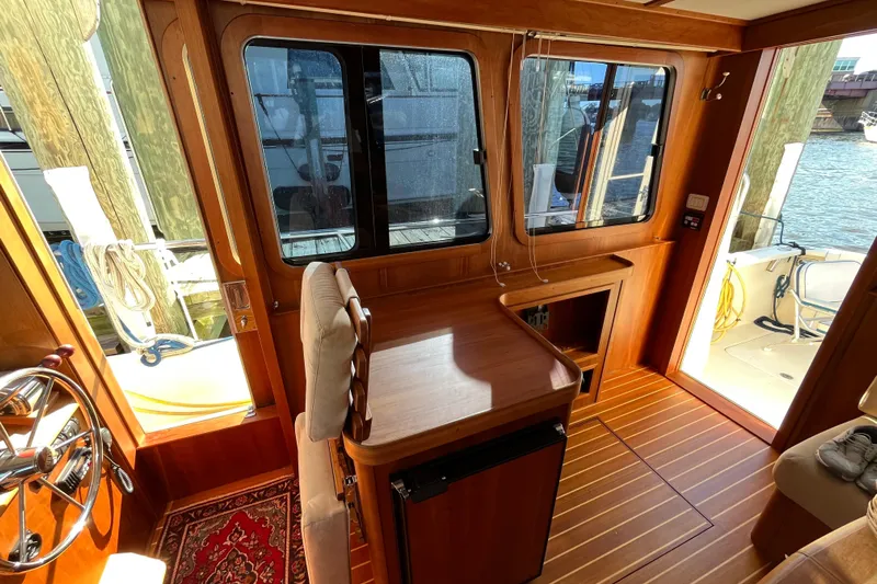 Sachem Yacht Photos Pics Interior of 2006 Sabre 36 Flybridge Sedan with wooden finish and nautical decor.