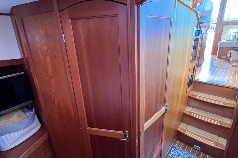 Sachem Yacht Photos Pics Interior of 2006 Sabre 36 Flybridge Sedan with wooden cabinetry and stairs.