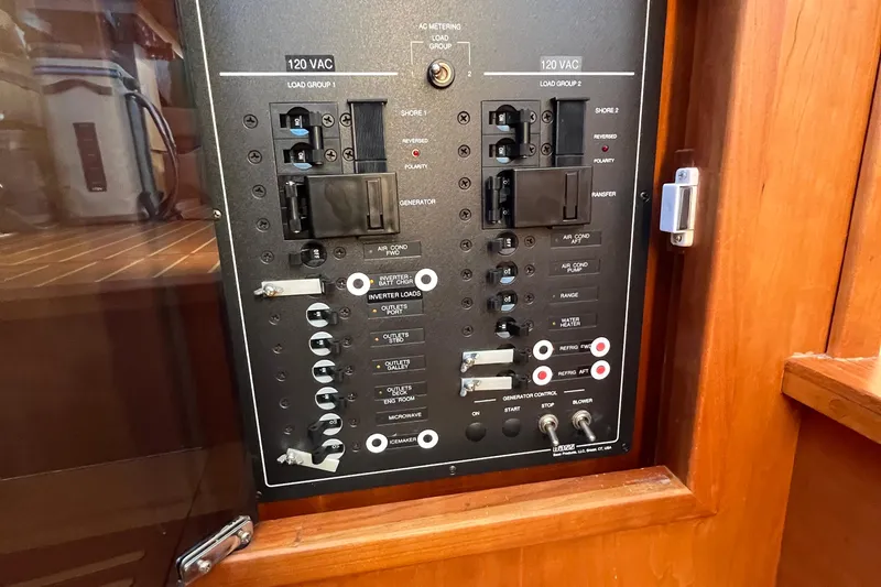 Sachem Yacht Photos Pics Electrical panel of 2006 Sabre 36 Flybridge Sedan boat, featuring various switches and controls.