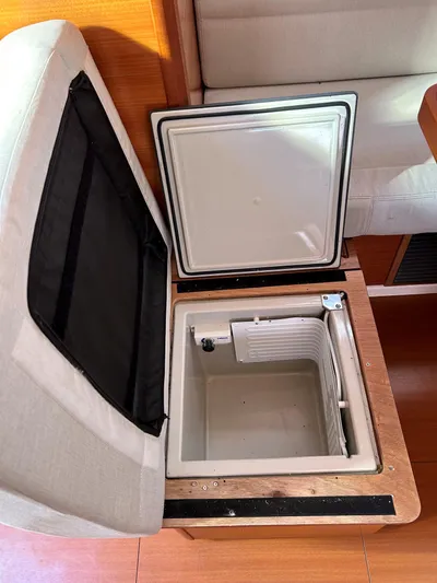 4770jg Yacht Photos Pics Open storage compartment in 2015 Dufour 410 GL yacht interior.
