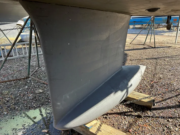 4770jg Yacht Photos Pics Dufour 410 GL 2015 sailboat keel on dry dock, gravel ground.