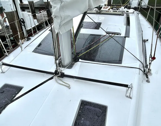 4770jg Yacht Photos Pics Dufour 410 GL 2015 sailboat deck with rigging and hatches in marina.