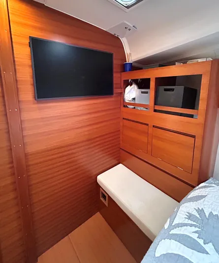 4770jg Yacht Photos Pics Interior of 2015 Dufour 410 GL yacht with wooden paneling and seating.