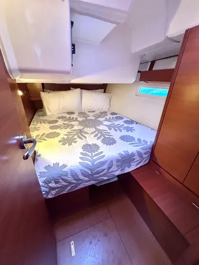 4770jg Yacht Photos Pics Cozy cabin interior of 2015 Dufour 410 GL sailboat with floral bedding.
