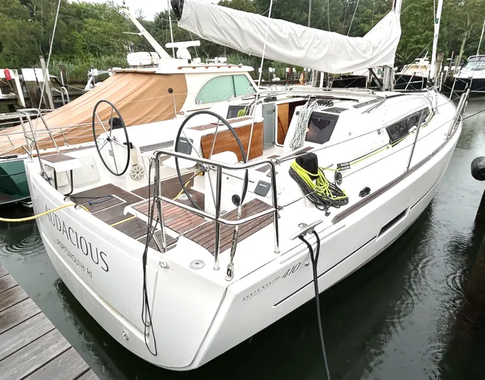 4770jg Yacht Photos Pics 2015 Dufour 410 GL sailboat docked, featuring dual steering wheels and sleek design.