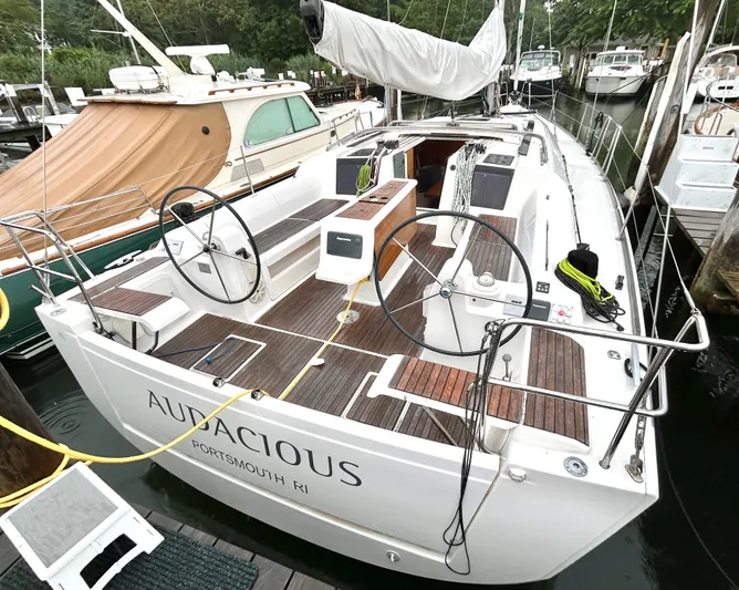 4770jg Yacht Photos Pics 2015 Dufour 410 GL sailboat docked, featuring dual steering wheels and spacious deck.