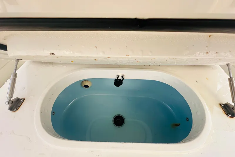  Yacht Photos Pics Livewell compartment on a 2015 Jupiter 38 FS boat, open and empty.