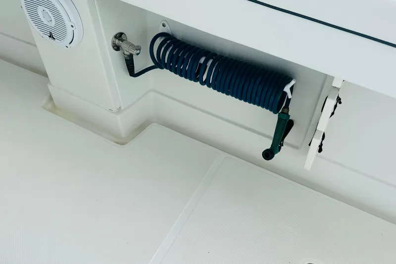  Yacht Photos Pics Coiled hose and speaker on 2015 Jupiter 38 FS boat deck.