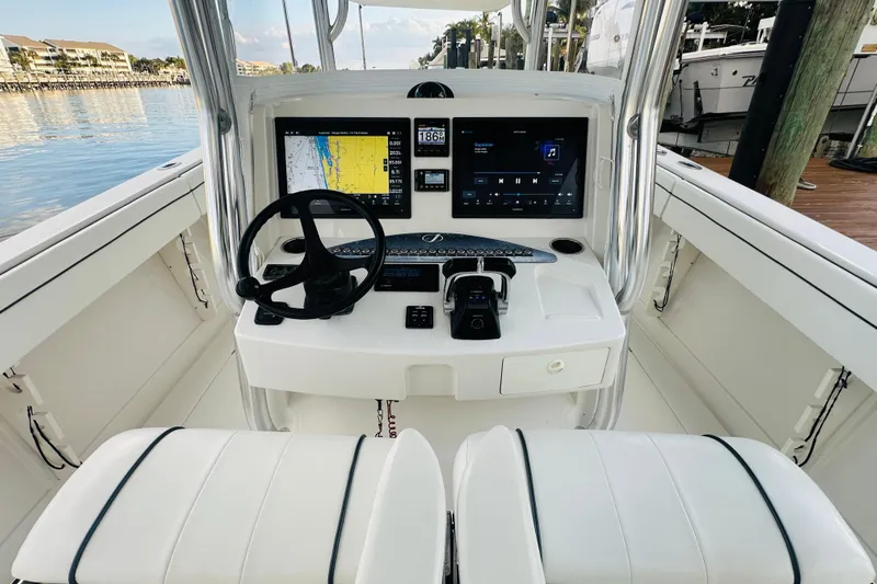 Yacht Photos Pics 2015 Jupiter 38 FS boat cockpit with dual screens and steering wheel.