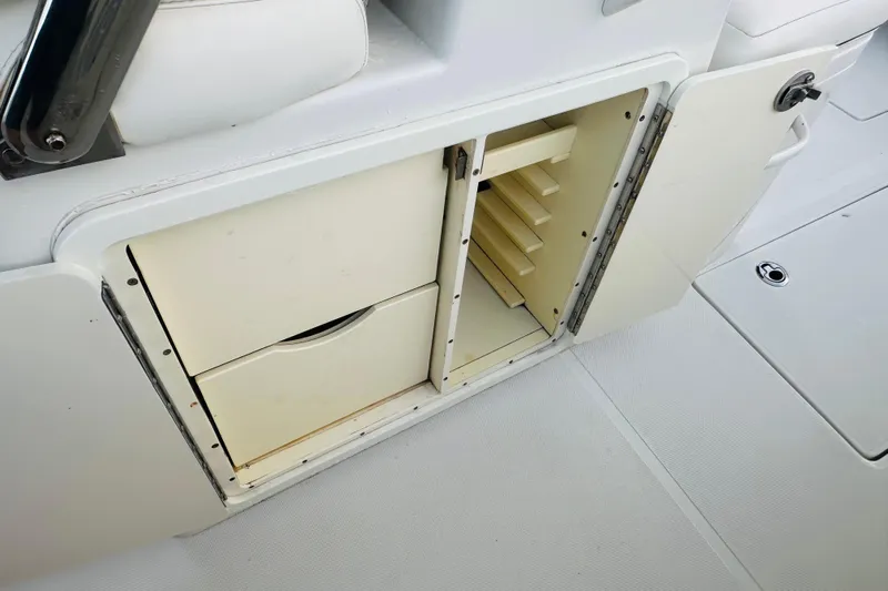  Yacht Photos Pics 2015 Jupiter 38 FS boat storage compartment with open drawers and shelves.
