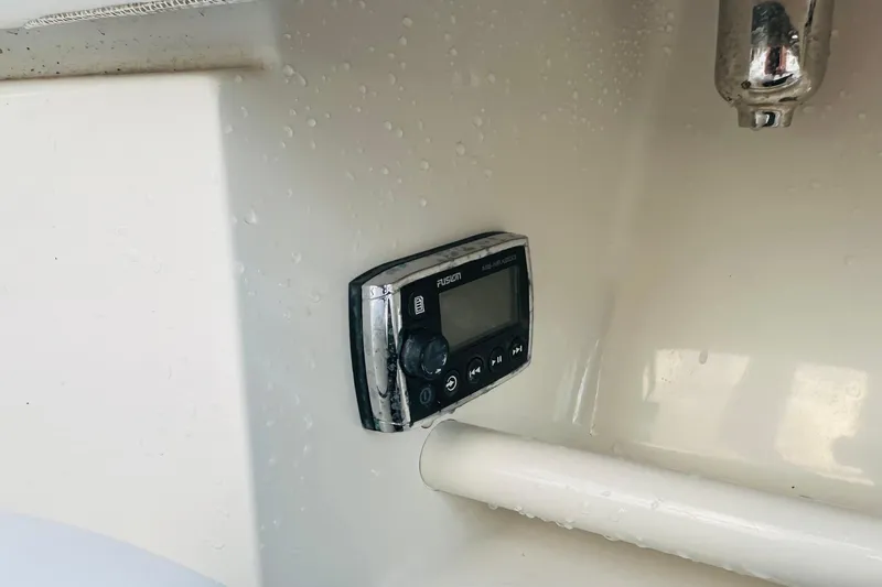  Yacht Photos Pics Fusion marine stereo on 2015 Jupiter 38 FS boat interior, with water droplets.
