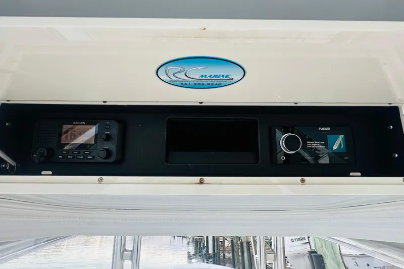  Yacht Photos Pics 2015 Jupiter 38 FS boat dashboard with Garmin and Fusion electronics.