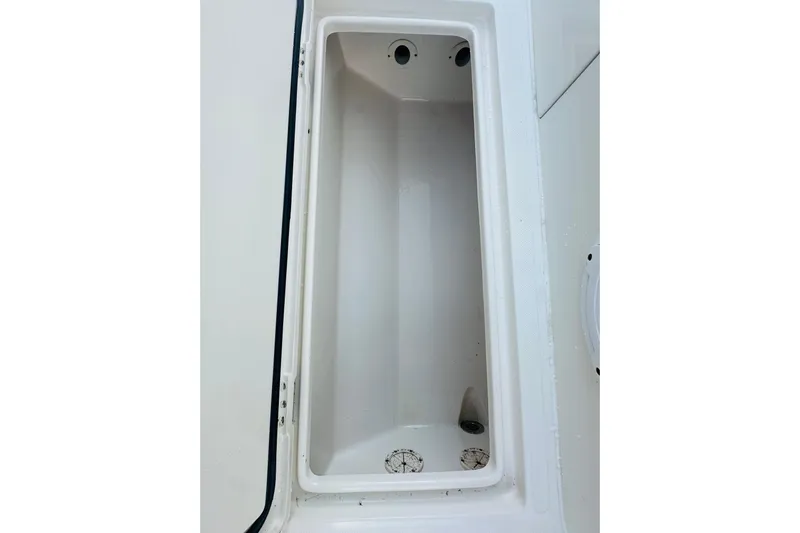  Yacht Photos Pics 2015 Jupiter 38 FS boat storage compartment, white interior, open lid.